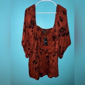 Torrid Burnt Orange brown blouse with Black Floral Design